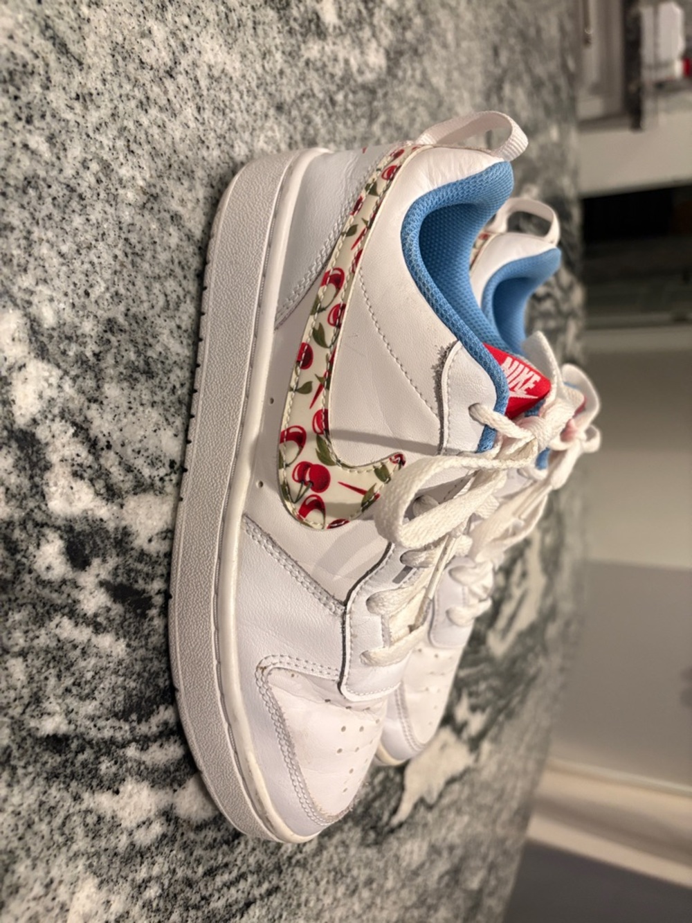Nike Kids White Sneakers with Cherry-Print Swoosh and Blue Lining
